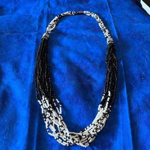 Multi strand sea bead vintage necklace with barrel clasp.